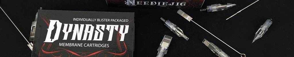 Needlejig's brand of cartridge tattoo needles and traditional tattoo needles on bar